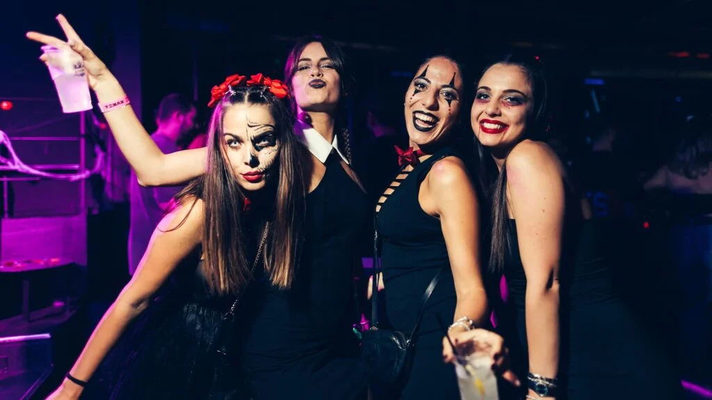 Friends with catrina and joker make-up at a Halloween party in Florence